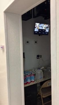 A room with a tv and some boxes