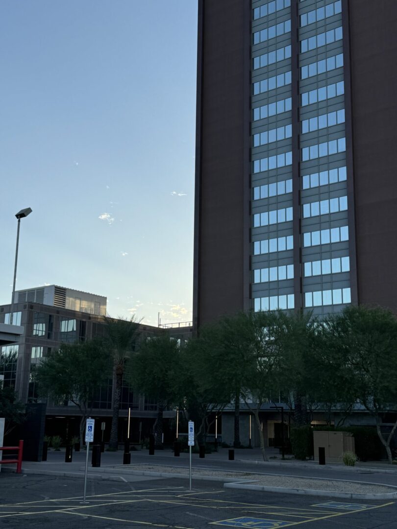 A tall building with trees in front of it